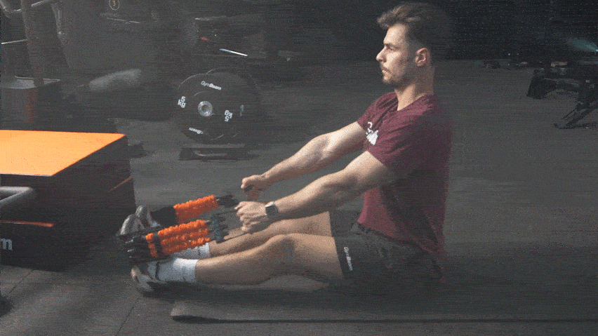 Seated Rows mit einem Widerstandsband Seated Rows mit einem Widerstandsband