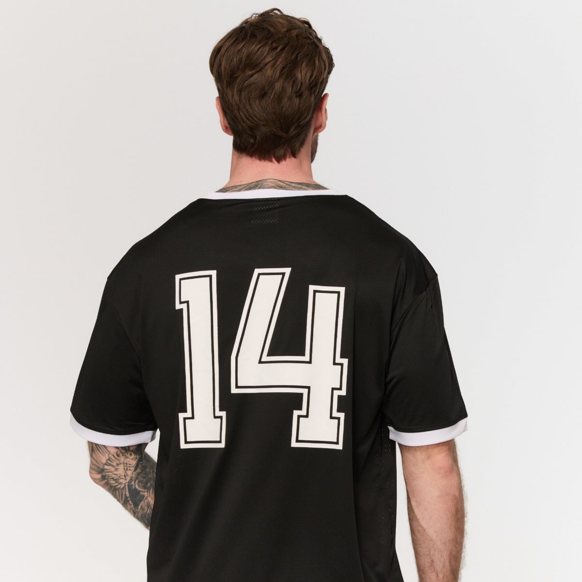 Oversize Varsity T-Shirt in Black - GymBeam